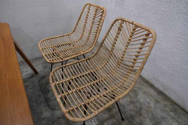 istock Set of chairs from rattan and table in cafe interior 1453703562
