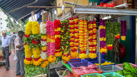 Singapore, Singapore - August 21, 2012. Colorful floral garlands used for Hindu worship displayed outside a small shop in Little India.