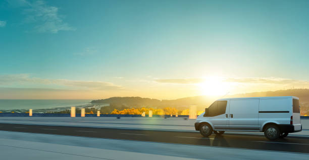 istock Van delivery on road at sunrise 1453704425