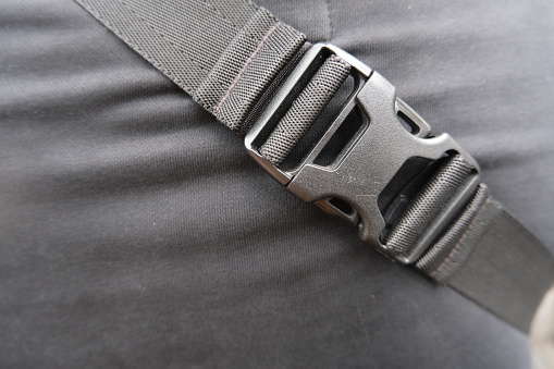 Black plastic belt clip, buckle fastex, length adjusters on bag or backpack strap, fasteners for paracord bracelet