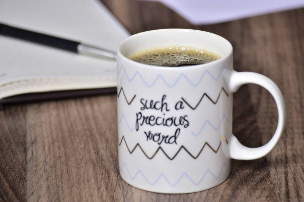 istock Such a precious word quote on black coffee mug on table 1453706895