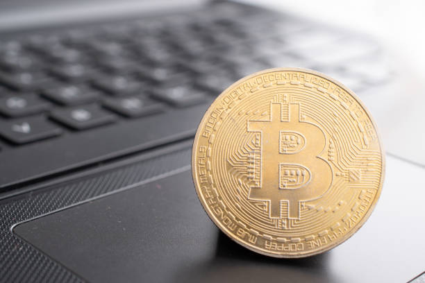 Closeup of bitcoin on computer table stock photo