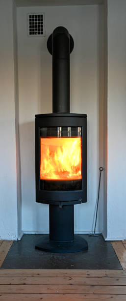 istock fire in fireplace indoor to heat up house 1453714018
