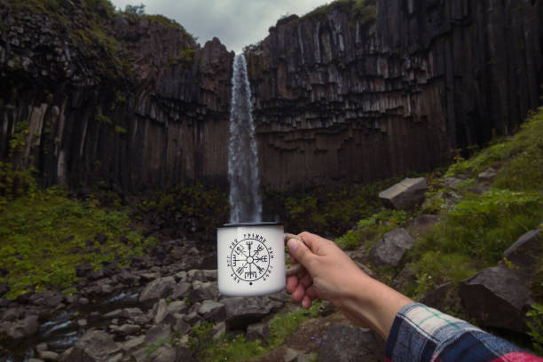 close up male hand imitating cup filling near waterfall concept photo - skaftafell national park 個照片及圖片檔