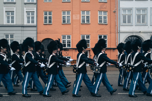 Oslo, Norway - May 17, 2012: The national day parade in the centre of Oslo. On Carl Johan in front of Grand Hotel, on the left hand side. A school marching band with white uniforms.