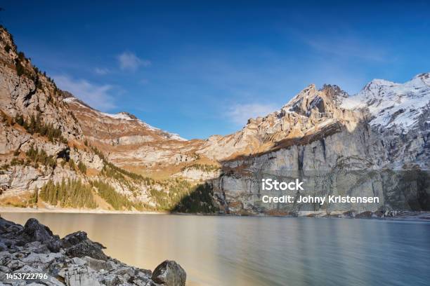 Landscape Of Oeschinen Lake From Heuberg Stock Photo - Download Image Now - Blue, Clear Sky, Color Image