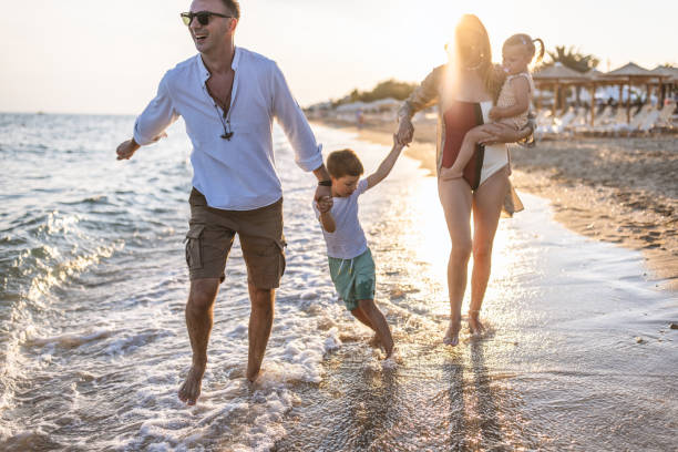 istock Young family spending day at the beach 1453723680