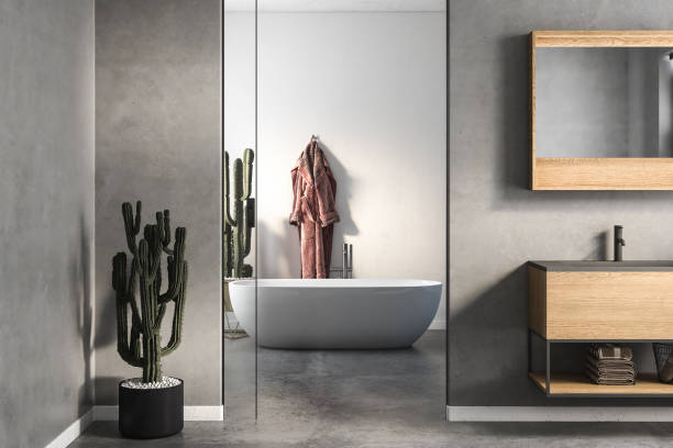 istock Modern minimalist bathroom interior, modern bathroom cabinet, white sink, wooden vanity, interior plants, bathroom accessories, bathtub, white and concrete walls, concrete floor. 3d rendering 1453725668