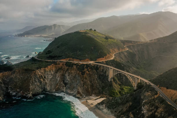 istock Birds eye view shot of bridge going over mountains 1453727187