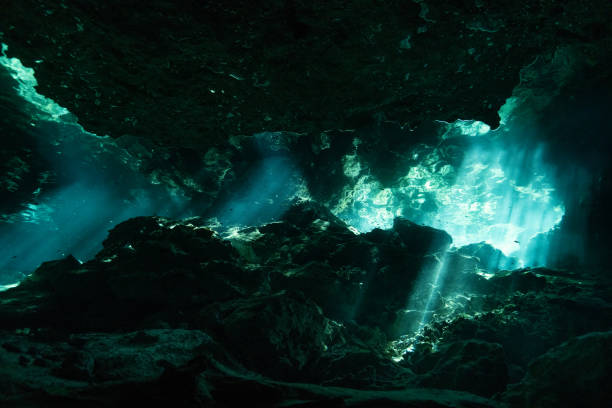istock Underwater scene with sun rays shining through the water 1453727354