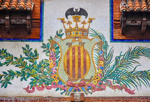 Gandia, Spain – July 22, 2015: A ceramic coat of arms of Valencia made up of mosaic little tiles in Gandia, Spain