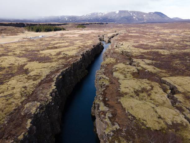 Aerial drone shot of the scenic rift valley in Thingvellir, Iceland An aerial drone shot of the scenic rift valley in Thingvellir, Iceland fault geology stock pictures, royalty-free photos & images