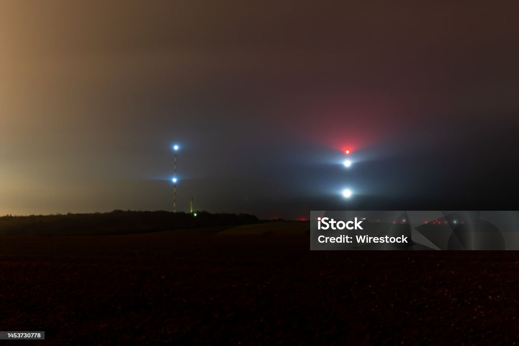 TDF tower of Willeroncourt, at night with lot of mist, Meuse , Franc TDF tower for TV chanel, take at night with mist and a little rain, in Meuse department, France Color Image Stock Photo
