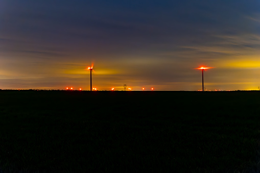 Lot of Wind turbine at night, with a cloud sky, ine Meuse department, France
