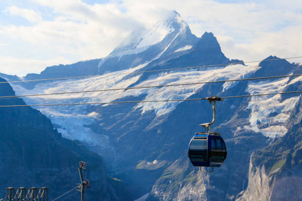 Chairlift with mountain peaks in background
