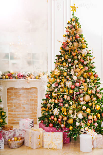istock A large beautiful traditional Christmas tree with gifts in a classic interior. 1453734913