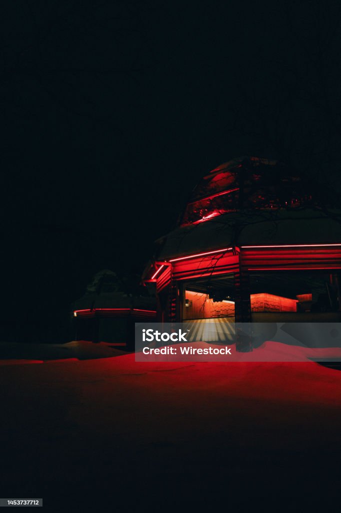 Buildigns in red light Igloo hotel in the night surrounded by red light Architecture Stock Photo