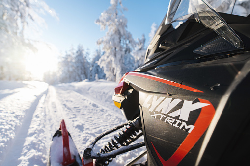 Rovaniemi, Finland – April 05, 2022: Lynx snowmobile waiting for the signal to go