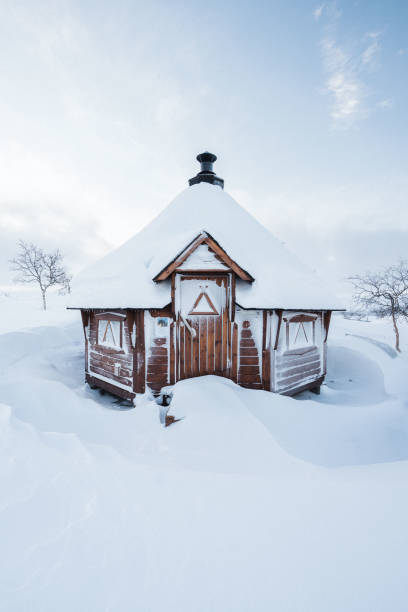 istock Lappish hut covered in snow 1453738064