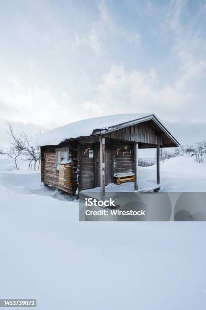 Hut With A Porch In Winter Landscsape Stock Photo - Download Image Now - Architecture, Blue, Building Exterior