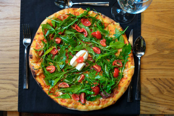 A top view shot of pizza in a restaurant