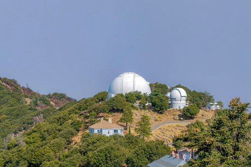 SAN JOSE, CALIFORNIA - CIRCA OCTOBER, 2021: Lick Observatory astronomical facility. Lick Observatory's Shane 120-inch telescope in the center with nearby Automated Planet Finder 100-inch reflector