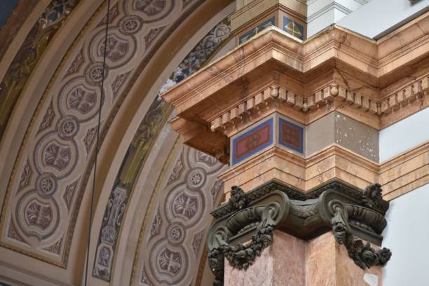 istock Low angle closeup shot of an ancient building's arch with decorative patterns on it 1453740383