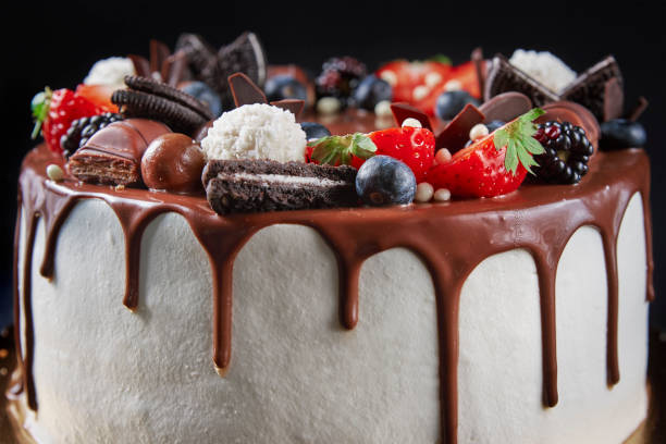 istock Cake decorated with strawberry and chocolate on dark background 1453741423