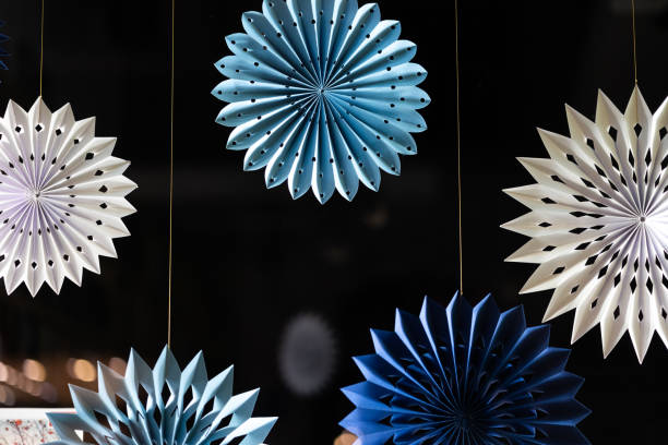 Paper Christmas decorations in the window of bookstore in Cracow. Poland