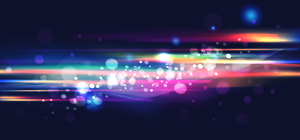 Abstract multi-coloured bokeh light on dark background