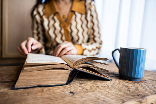 istock Asian women reading a book at home 1453746941