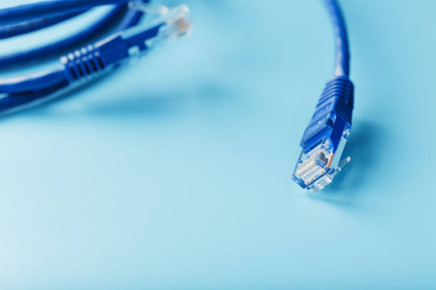 istock A coil of an Internet network cable for data transmission on a blue background 1453748119