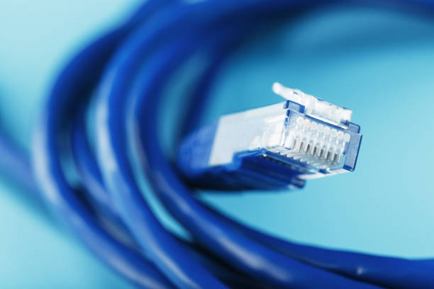 istock A coil of an Internet network cable for data transmission on a blue background 1453748138