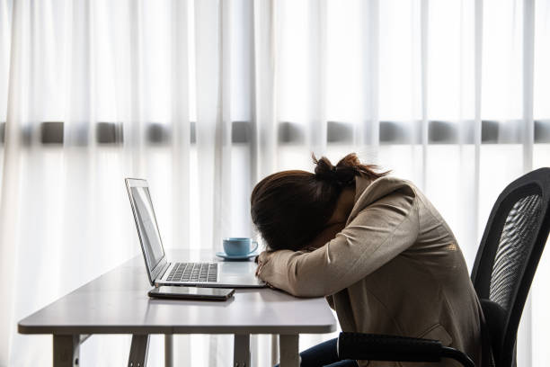 istock Tired businesswoman 1453749627