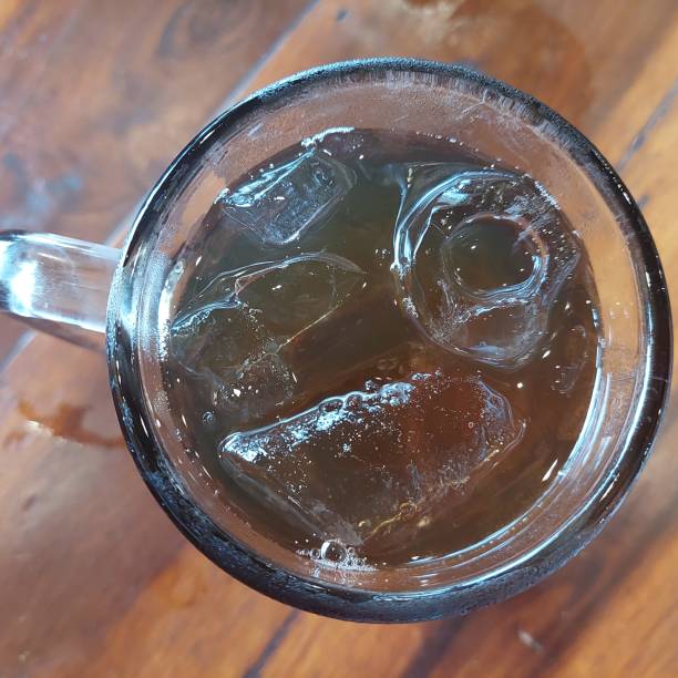 istock Iced lemon tea with ice cubes in a large glass 1453749781