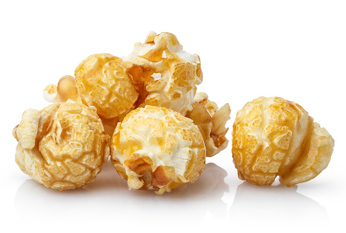 Delicious caramel popcorn, isolated on white background