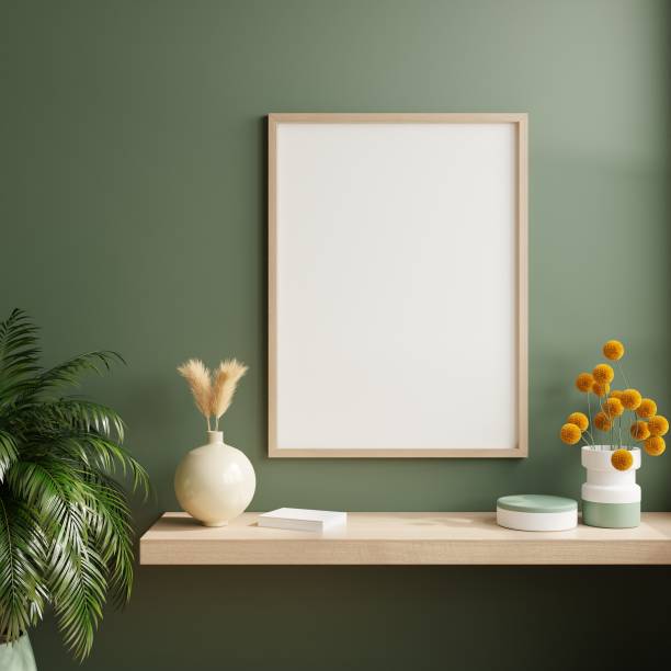 istock Mockup poster frame in minimalist interior background with dark green wall. 1453752727