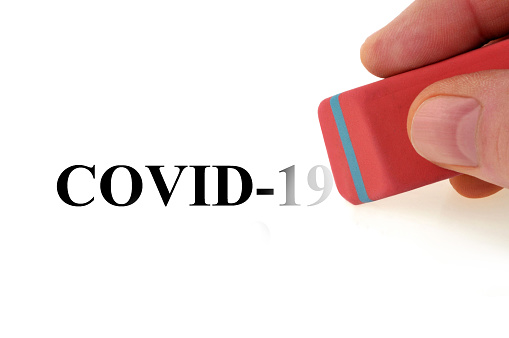 End of covid-19 epidemic concept erased with eraser
