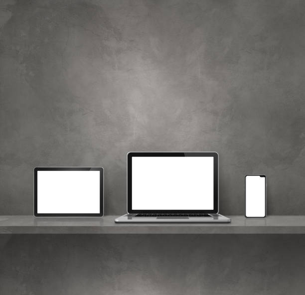 istock Laptop, mobile phone and digital tablet pc on grey wall shelf. Square background 1453753686