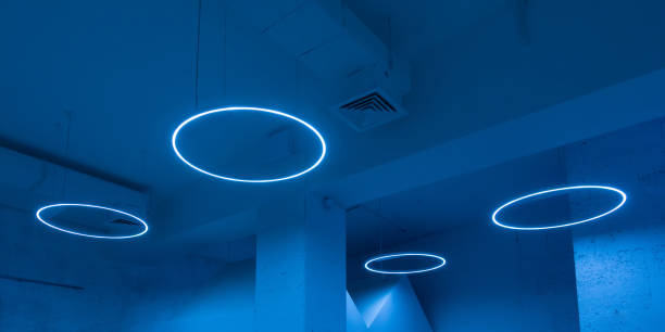Ceiling with round modern LED lamps. Suspended fluorescent lights under the ceiling. Careful energy consumption, energy saving concept