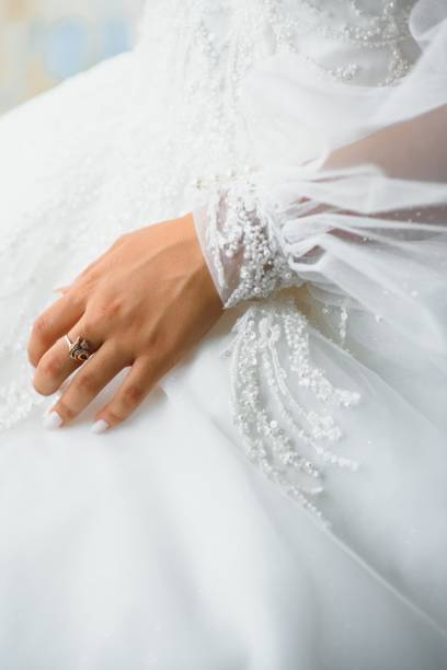 istock Bride dressing wedding gown. morning bride. 1453758112