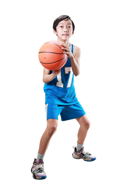 istock Young boy playing basketball isolated on white 1453759224