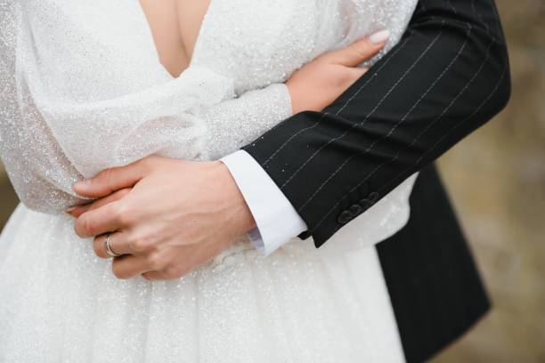 istock Hands of the bride and groom close-up. 1453761826