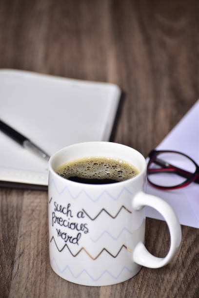 istock Black coffee in quote mug on office table 1453762582