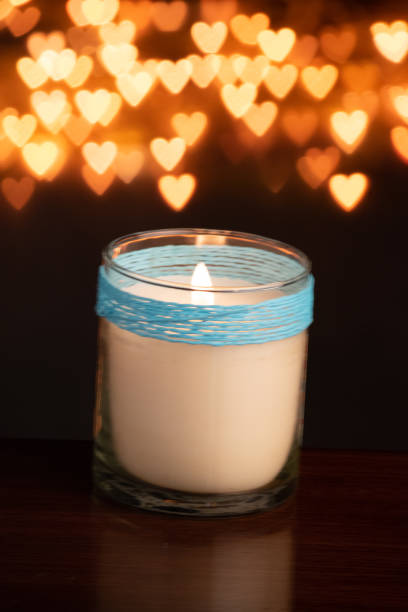 istock Candle blowing against heart shape bokeh background 1453763659