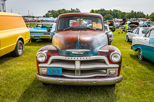 Iola, WI - July 07, 2022: High perspective front view of a 1954 Chevrolet 3100 Pickup Truck at a local car show.