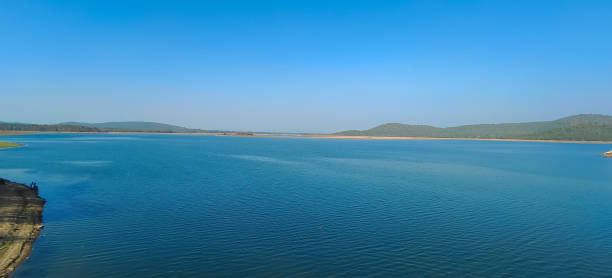 istock Blue river with clear blue sky and green forest background, blue lake panoramic view 1453765626