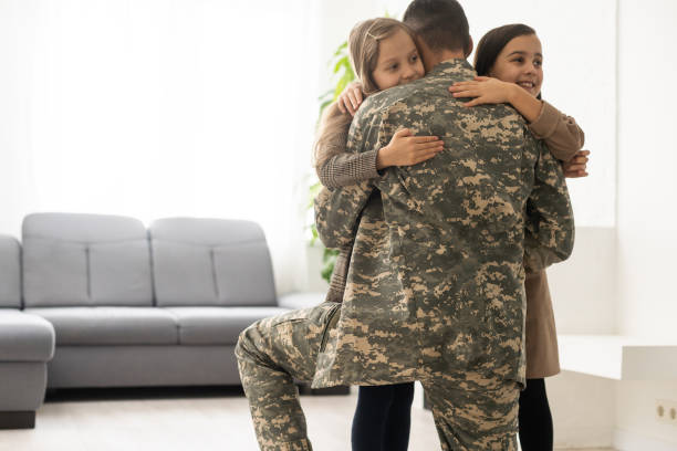 istock military father and two daughters at home 1453767671