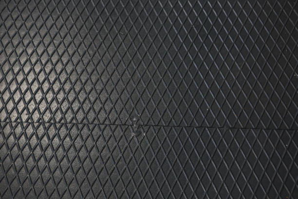 istock Black metal texture steel background. Perforated sheet metal. 1453769487
