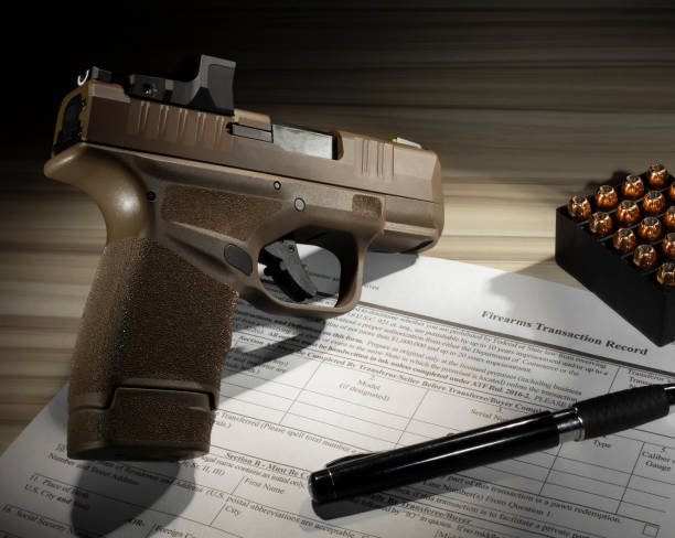 istock Semi auto pistol with background check for its purchase 1453771774
